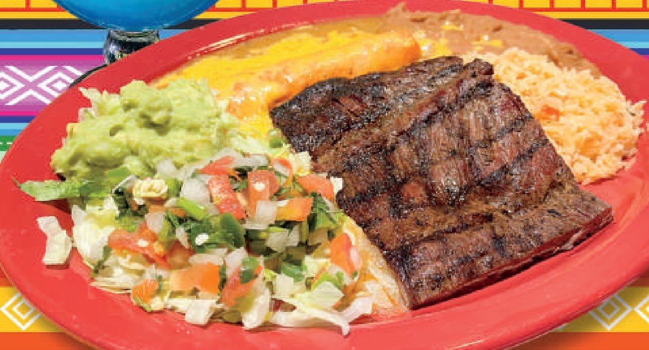 Grilled skirt steak plate with guacamole, pico de gallo, rice and beans